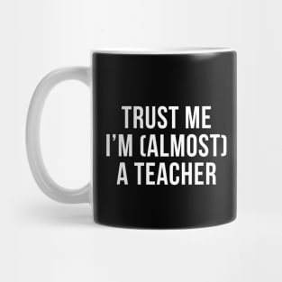 Trust me I'm (almost) a teacher. In white. Mug